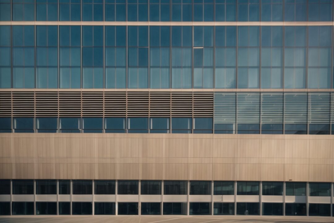 Boston corporate office building with sunlight filtering through tinted windows